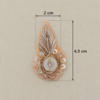 Decorative brooch with measurements on a beige background