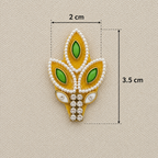 Decorative brooch with green gemstones and gold accents, shown with measurements on a beige background.