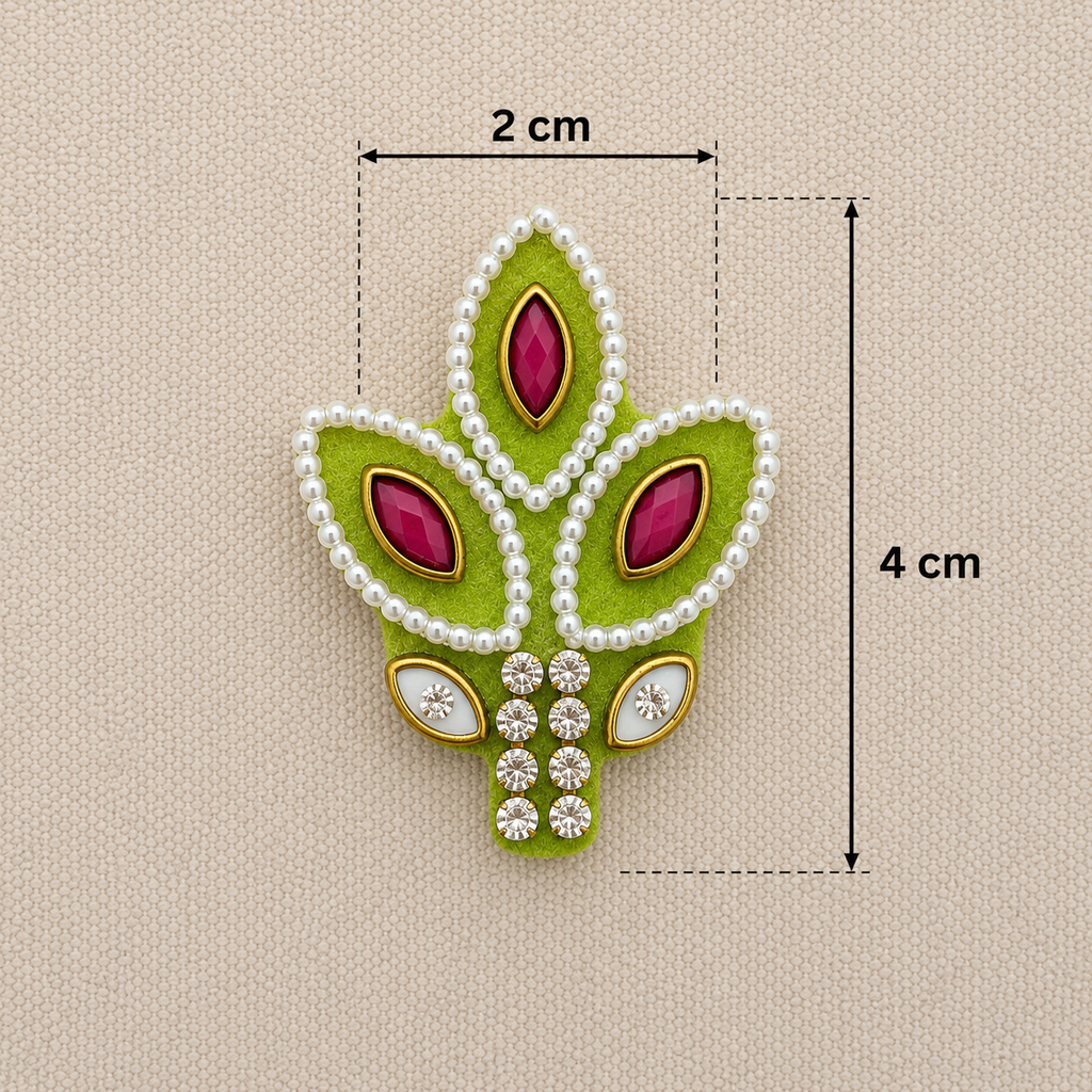 Decorative green leaf-shaped piece with pink stones and pearl-like beads, shown with measurements on a beige background.