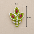 Decorative green leaf-shaped piece with pink stones and pearl-like beads, shown with measurements on a beige background.