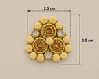 Gold brooch with floral elements and gemstones, shown with measurements on a beige background