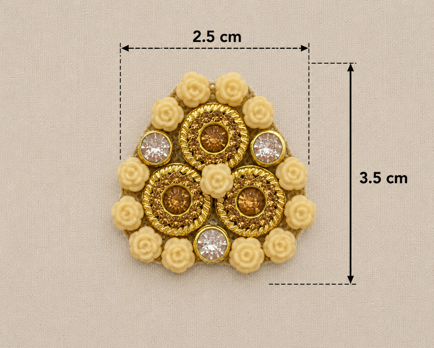 Gold brooch with floral elements and gemstones, shown with measurements on a beige background