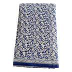 Blue and white patterned fabric on a white background