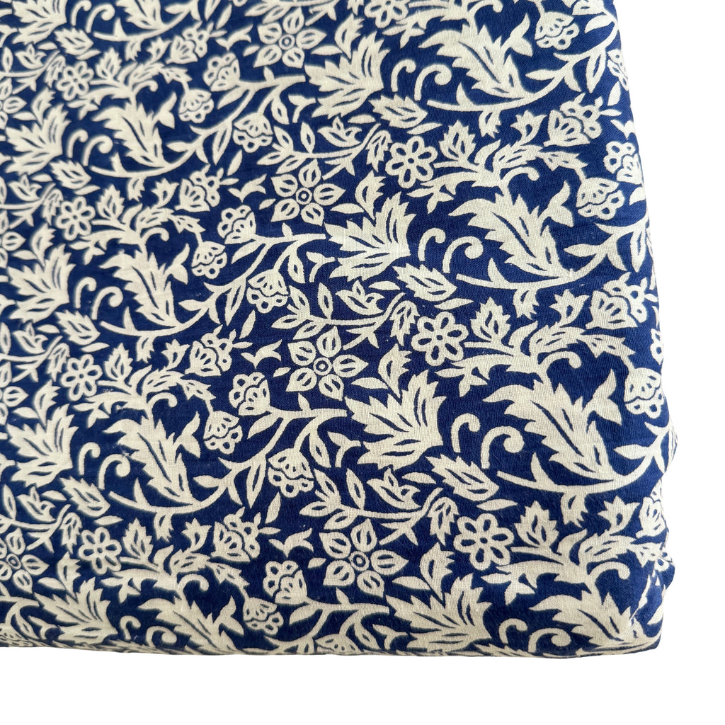 Navy blue fabric with white floral pattern