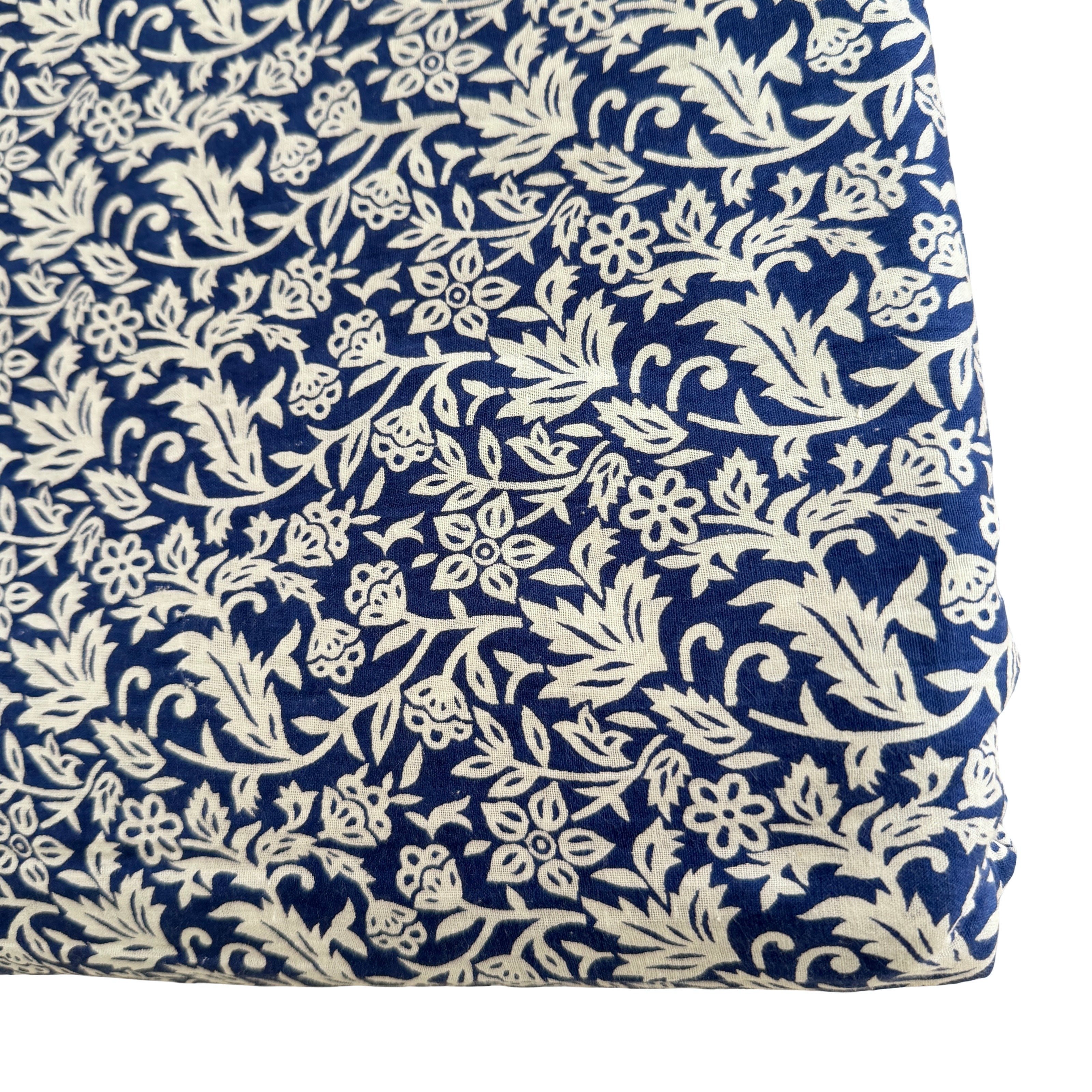 Navy blue fabric with white floral pattern