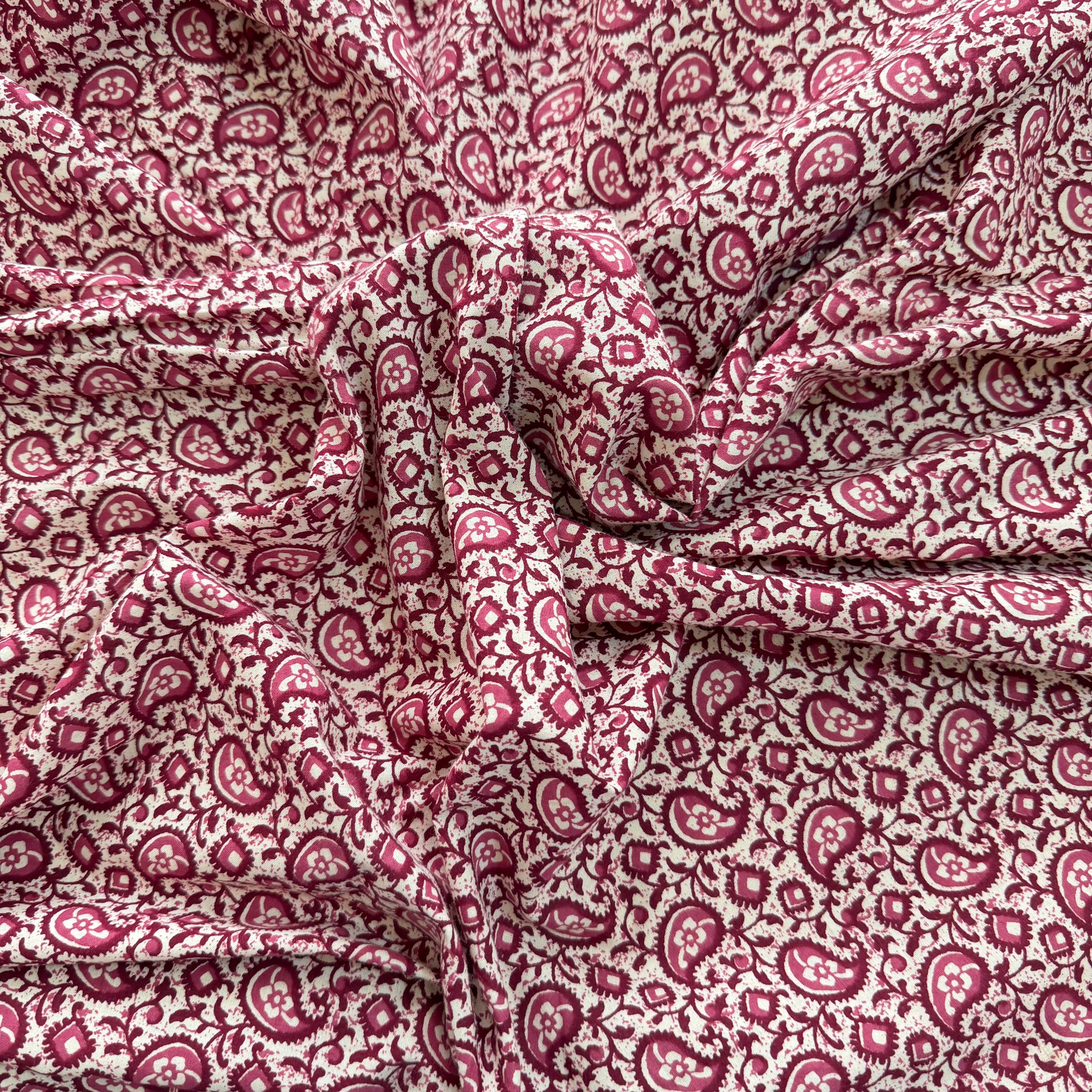 Close-up of red paisley patterned fabric
