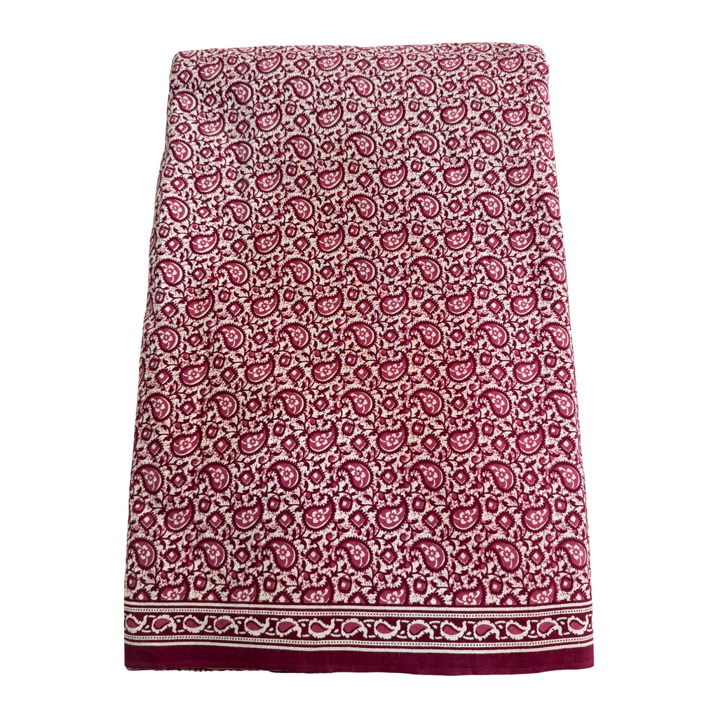 Patterned skirt with a red and white design on a white background