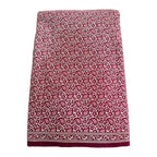Patterned skirt with a red and white design on a white background