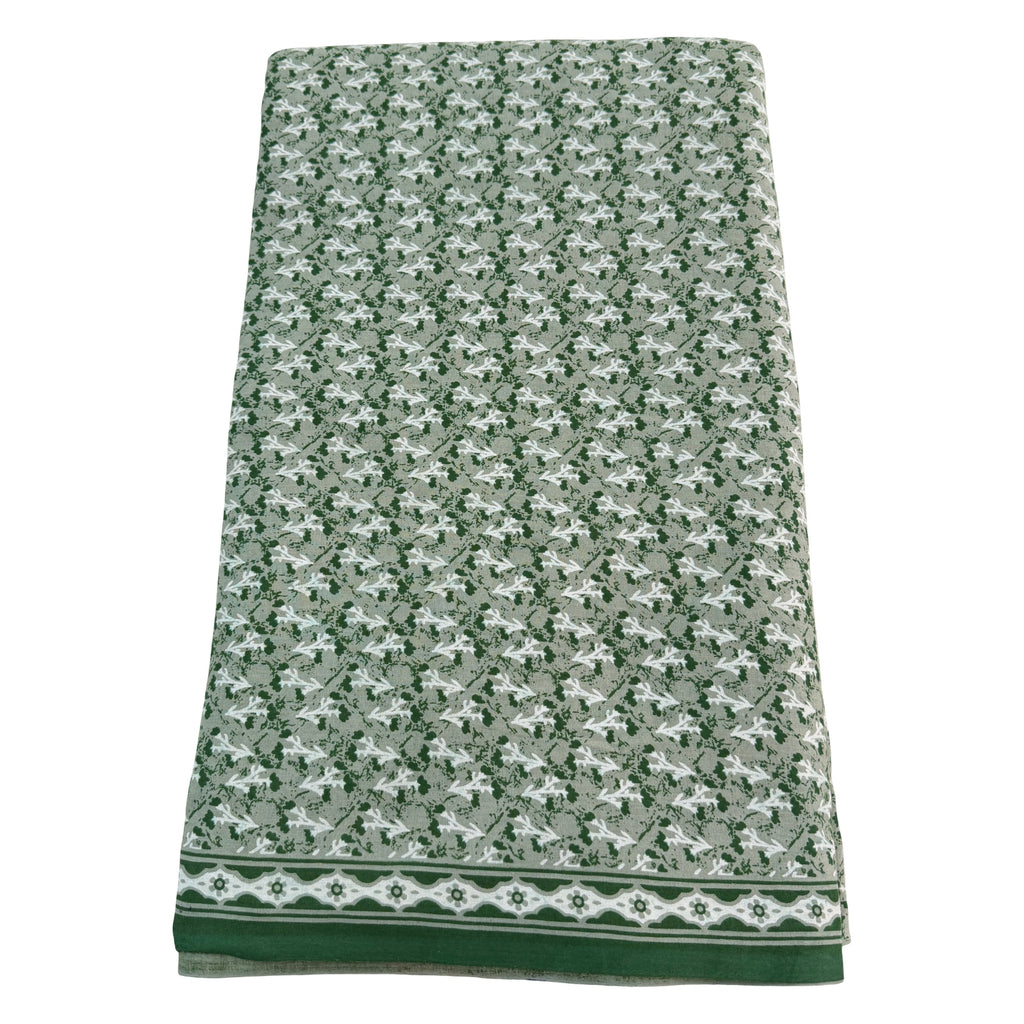 Green and white patterned towel on a white background