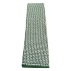 Green patterned towel on a white background