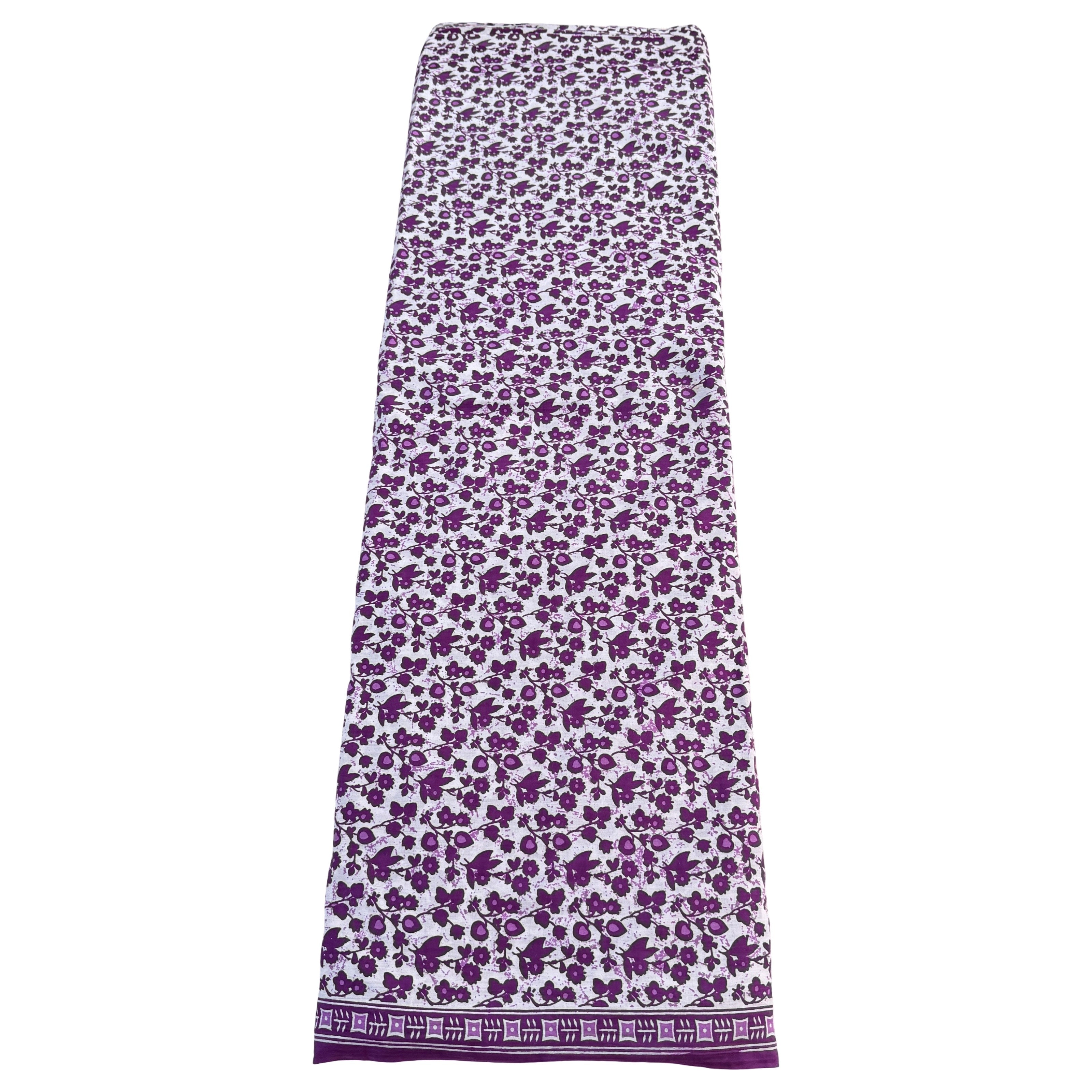 Long skirt with purple floral pattern on a white background