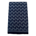 Navy blue towel with white floral pattern on a white background