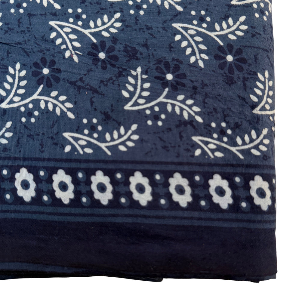 Navy blue fabric with white floral and leaf pattern