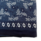 Navy blue fabric with white floral and leaf pattern