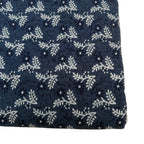 Navy blue fabric with white floral pattern
