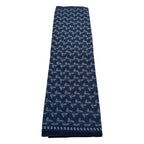 Navy blue scarf with white floral pattern on a white background