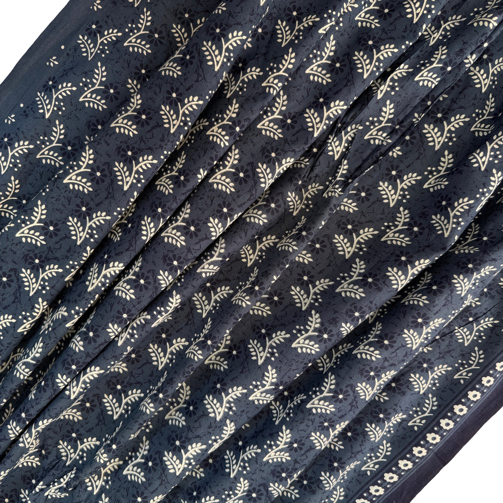 Navy blue fabric with white floral pattern