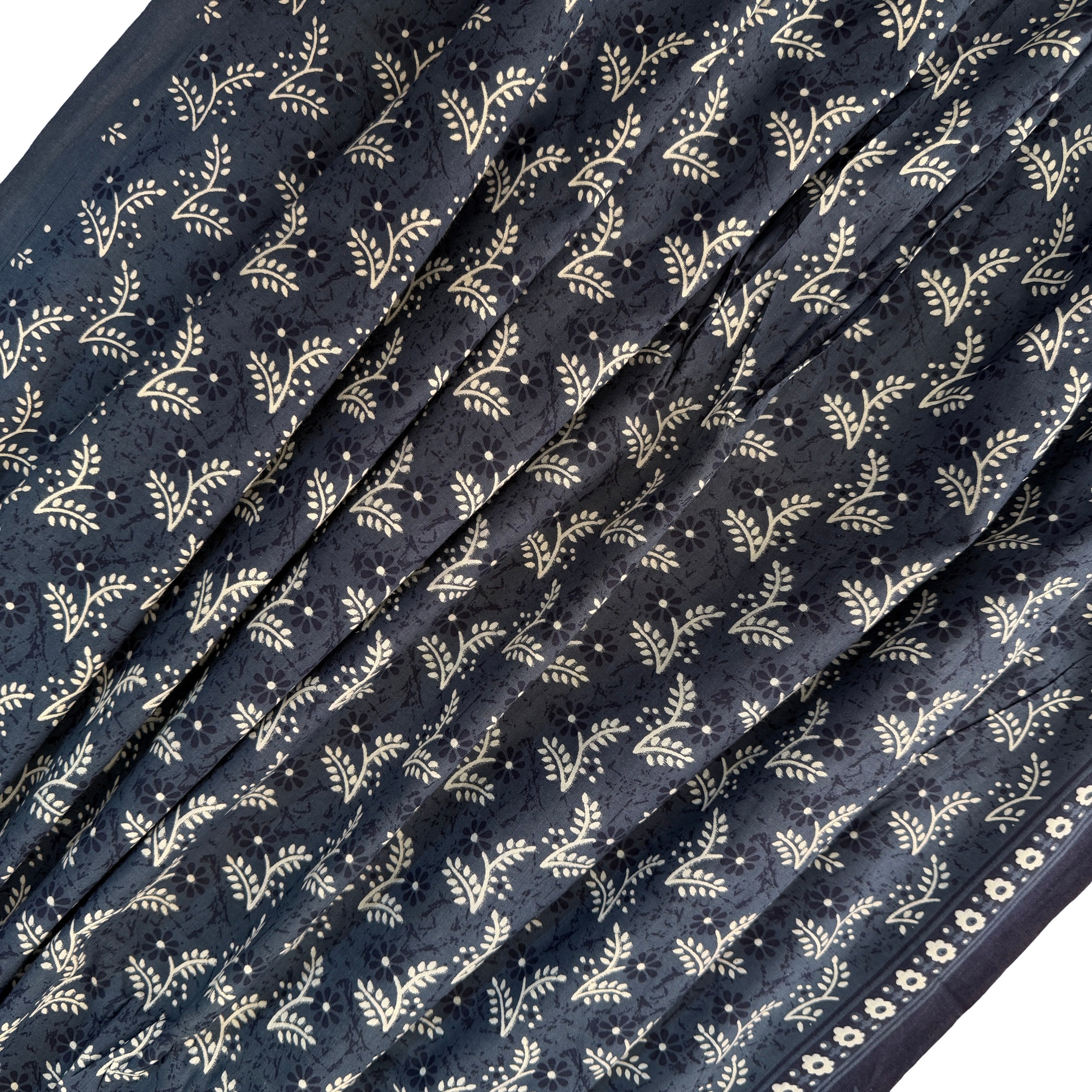 Navy blue fabric with white floral pattern
