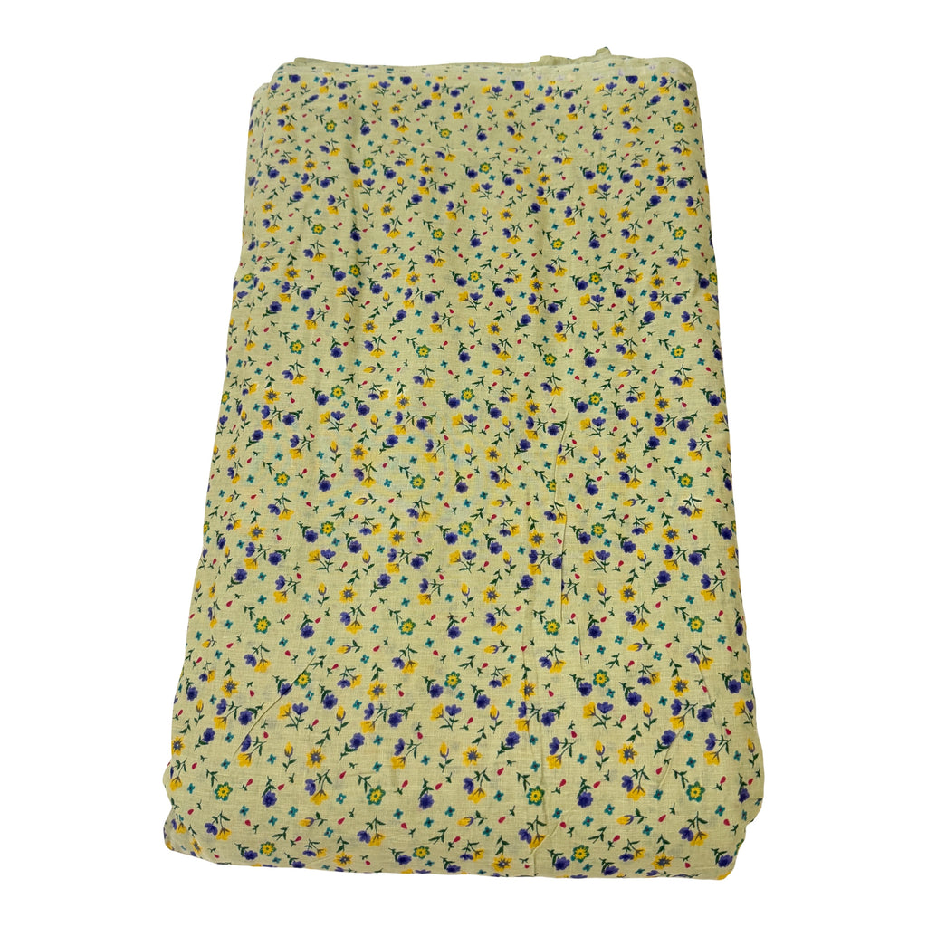Folded fabric with small floral pattern on a white background