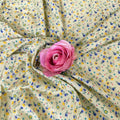 Floral fabric with a pink rose in the center