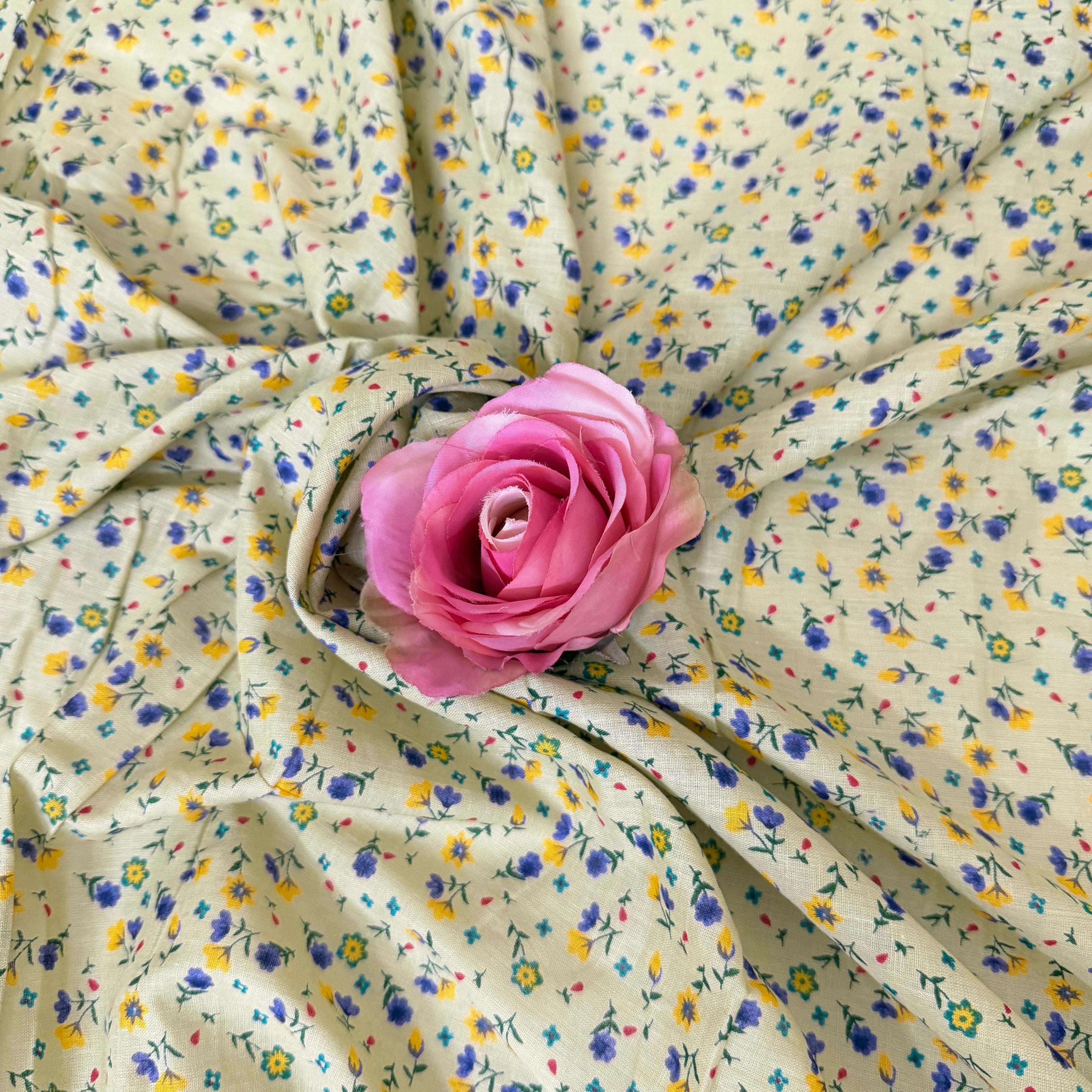 Floral fabric with a pink rose in the center