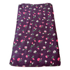 Floral patterned fabric on a purple background