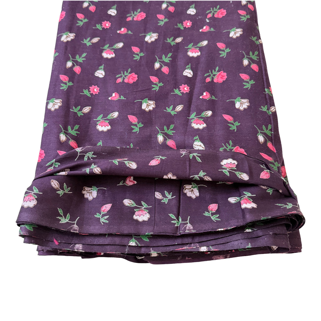 Folded Wine fabric with floral pattern on a white background