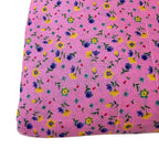 Pink fabric with small colorful floral pattern