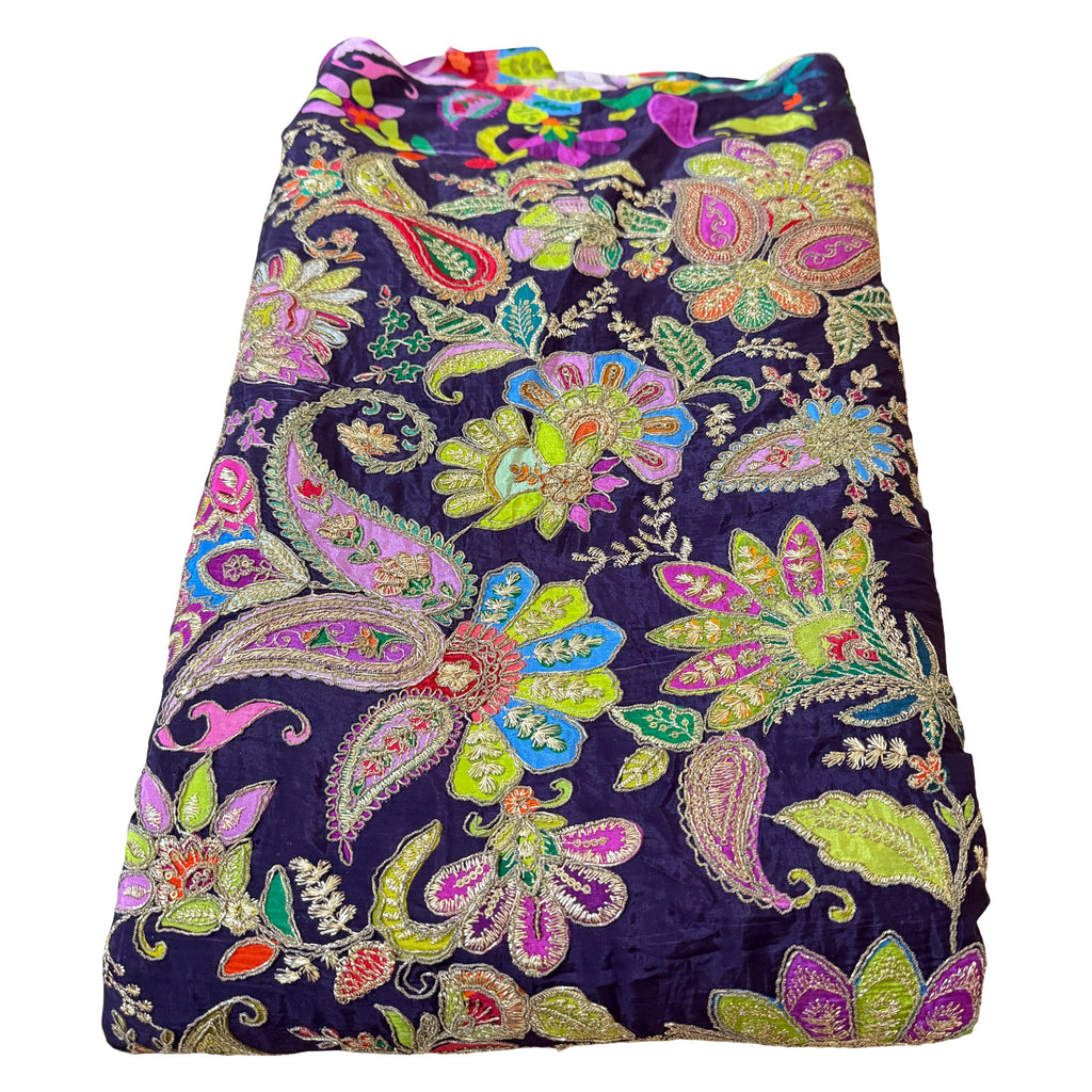 Colorful paisley patterned fabric on a white background