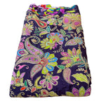 Colorful paisley patterned fabric on a white background