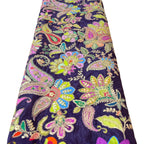 Colorful paisley patterned fabric on a white background
