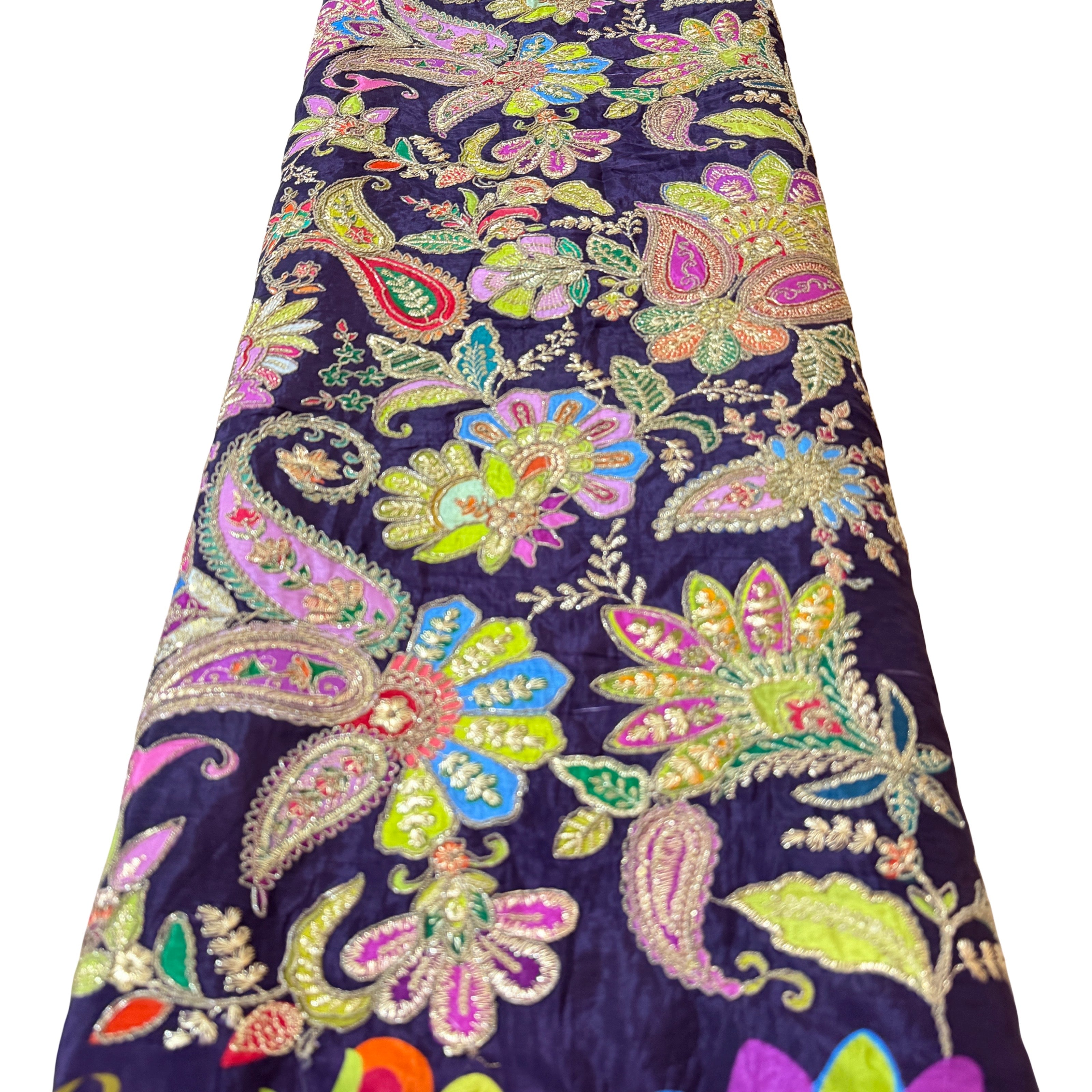Colorful paisley patterned fabric on a white background