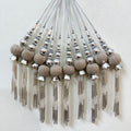 Decorative tassels with beads on a white background