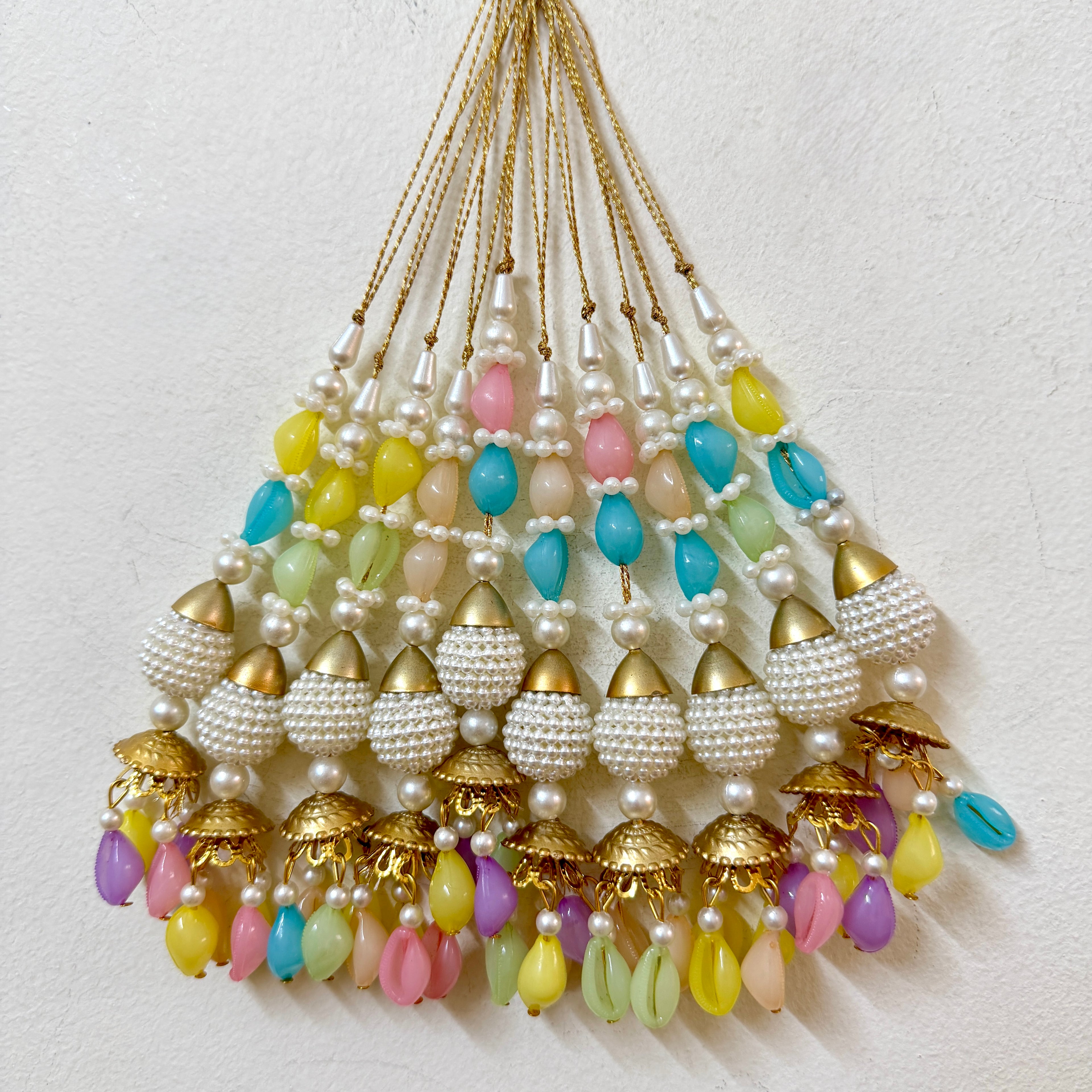 Colorful beaded necklace with gold accents on a white background