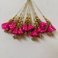 Pink and gold decorative items on a light background
