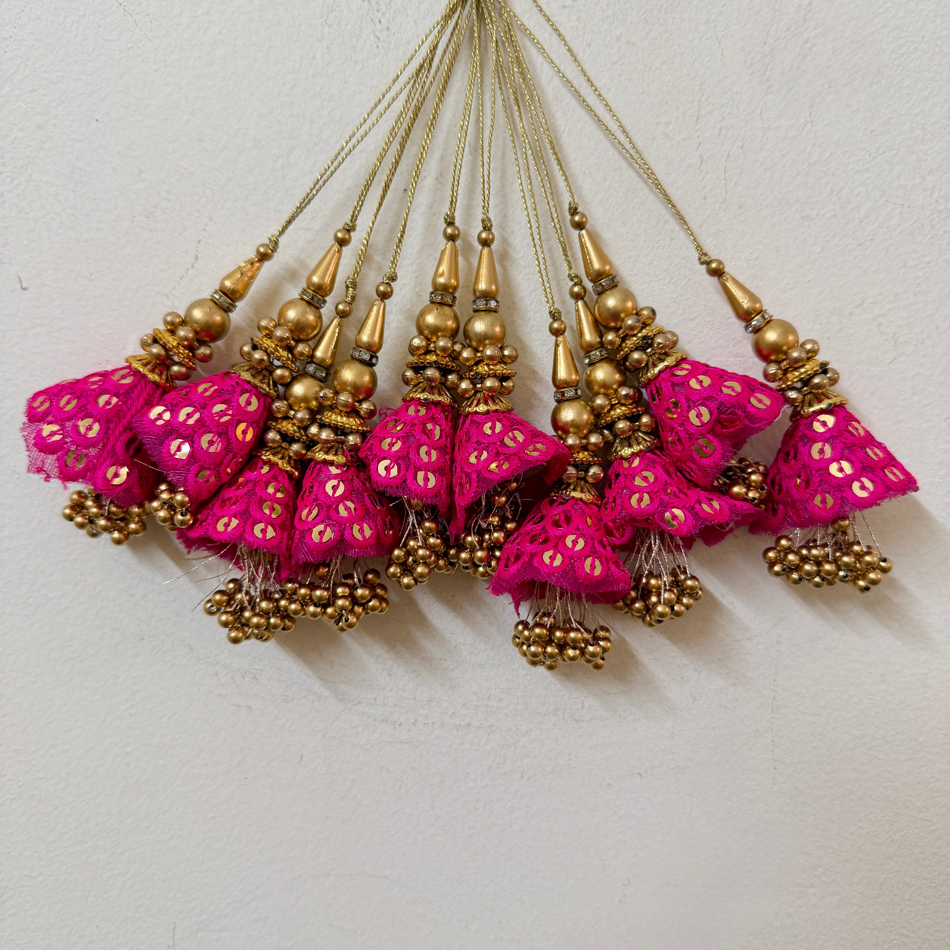 Pink and gold decorative items on a light background