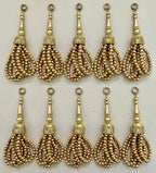 Gold tassels with beaded design on a white background