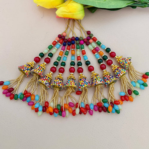 Colorful beaded tassel necklace with gold accents on a light background