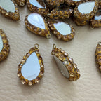Champagne rhinestone teardrop mirror tassel shown beside ruler for size