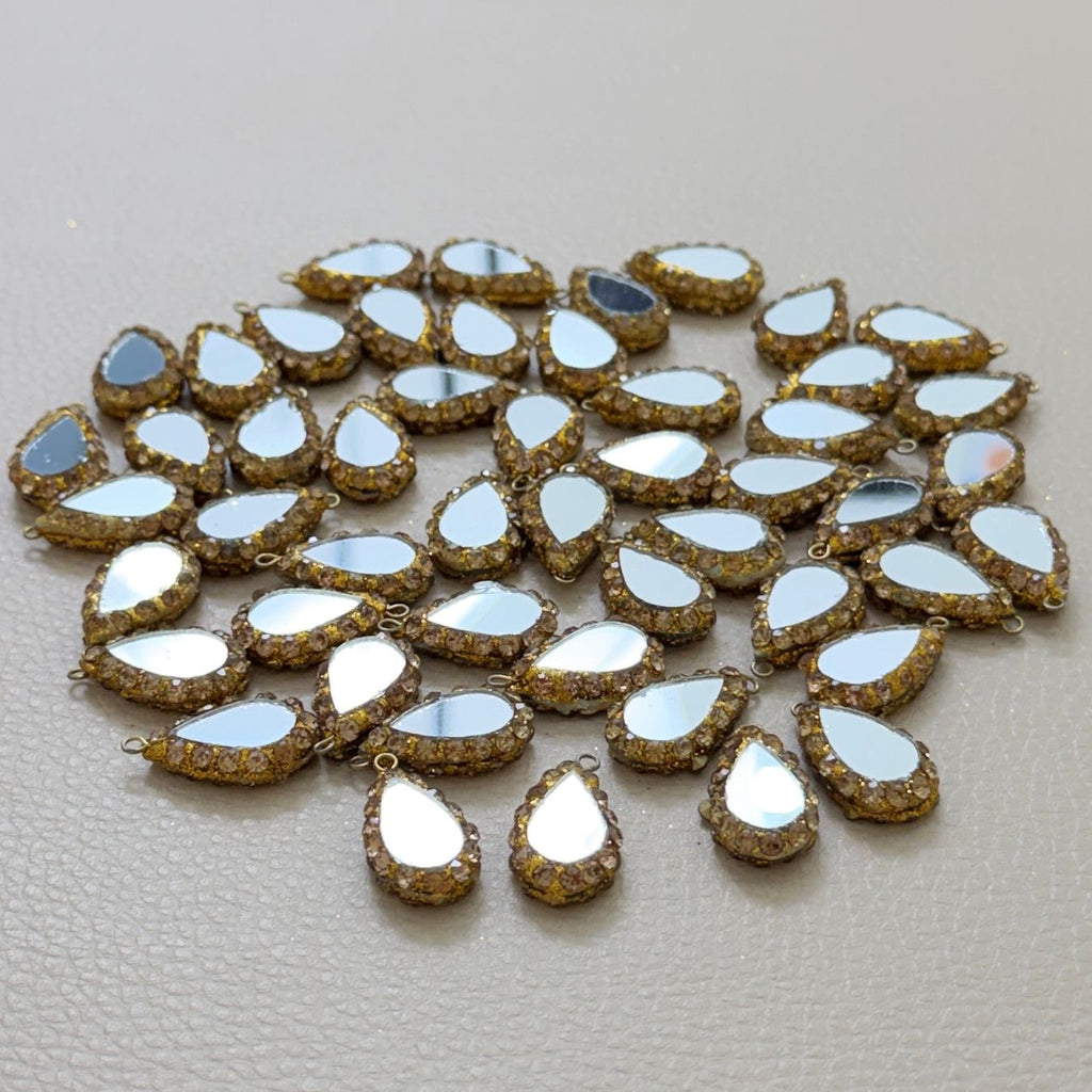 Champagne rhinestone teardrop mirror charms arranged for crafts