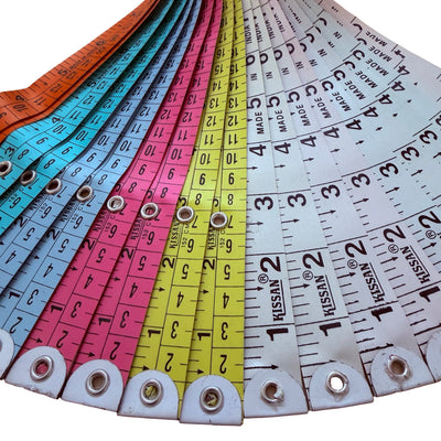 Set of colorful measuring tapes with brand name 'Kissan' on a white background