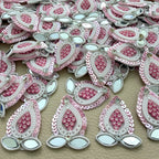 Collection of pink sequin patches with white pearl-look beads and leaf-shaped mirror accents