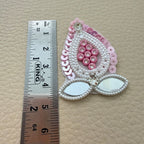 Pink teardrop patch beside ruler showing approximately 4.5 cm length