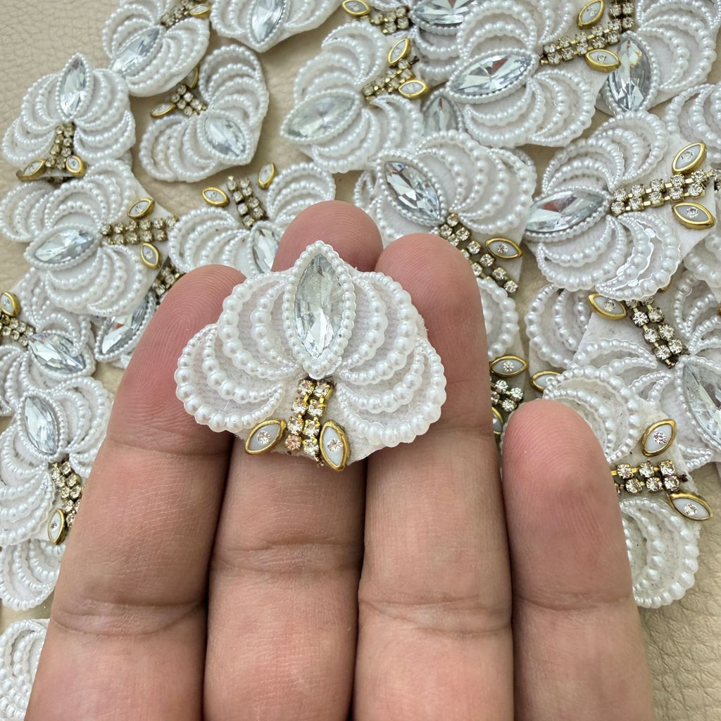 Two white fan-shaped patches with pearl-effect beads, clear marquise stones and gold-tone accents