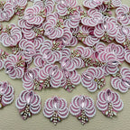 Group of pink fan-shaped patches with white pearl-effect beads and rhinestone details