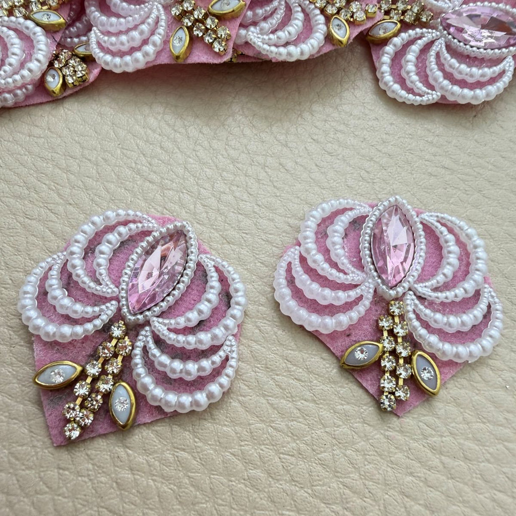Two pink fan patches with white pearl-effect bead loops, pink marquise stones and gold-tone rhinestone accents