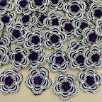 Purple rose flower patch with white pearl-look beads and clear rhinestones shown in hand
