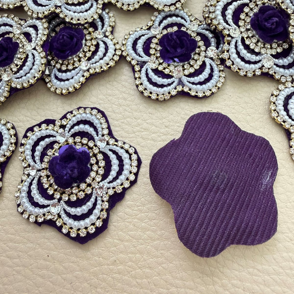 Front decoration and plain purple fabric backing of flower patch