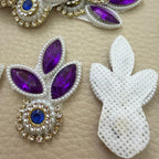 Front purple leaf design and white mesh backing of decorative stone patch