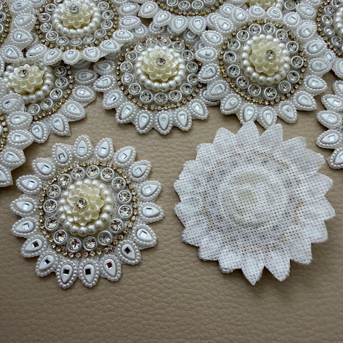 Collection of ivory pearl-look and mirror floral round patches